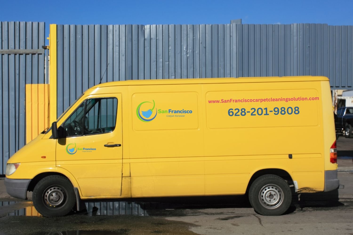 Yellow van parked outside a building, advertising a carpet and rug cleaning service in San Francisco, CA.